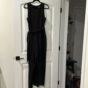 Black split leg jumpsuit, side pockets